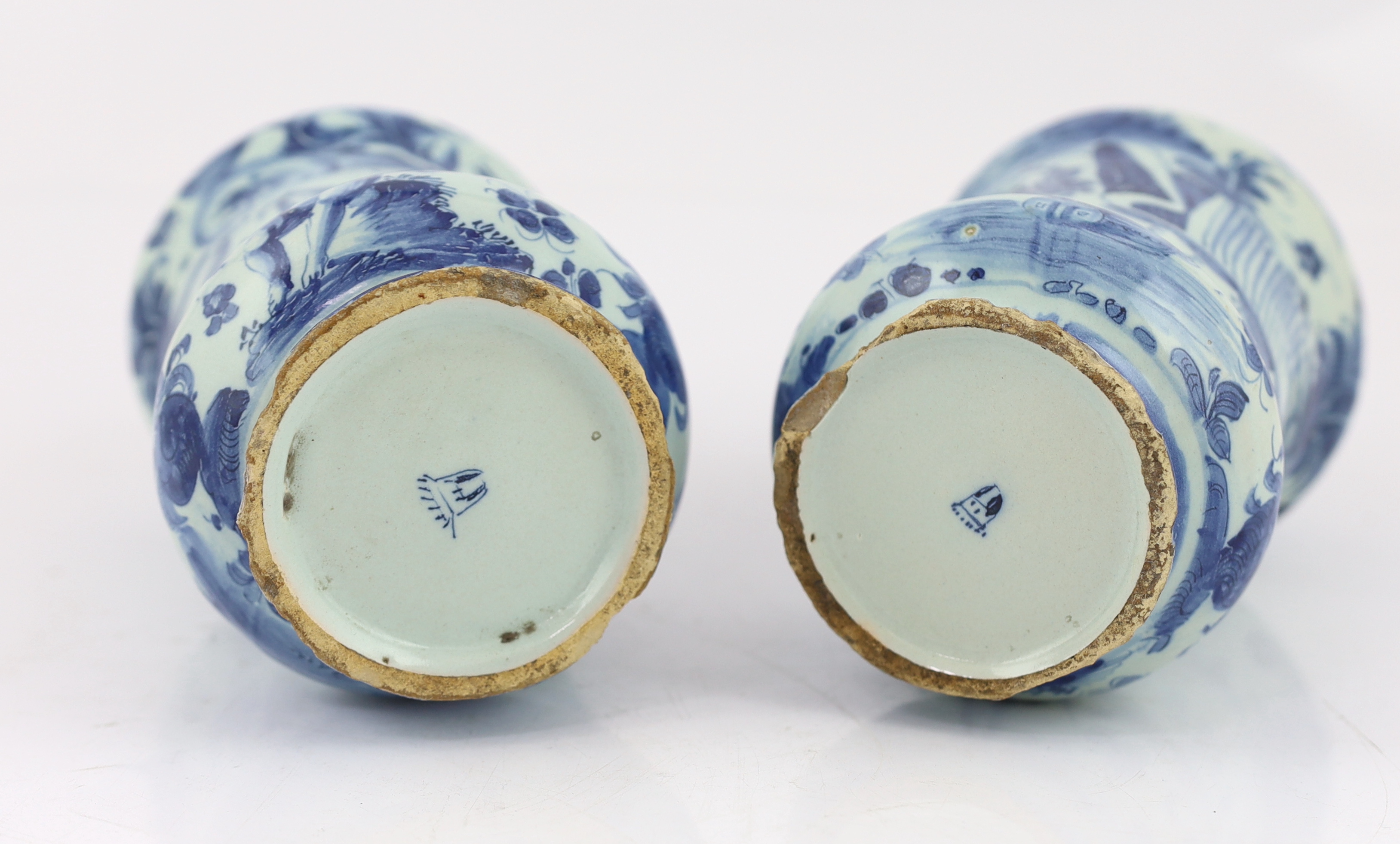 A pair of Italian blue and white maiolica albarellos, Savona, late 17th century, glaze losses, latter chipped